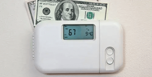 dollar bills on thermostat