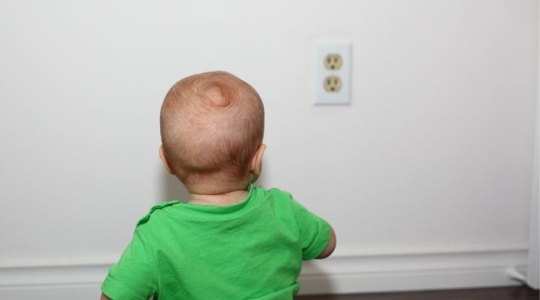 baby next to outlets