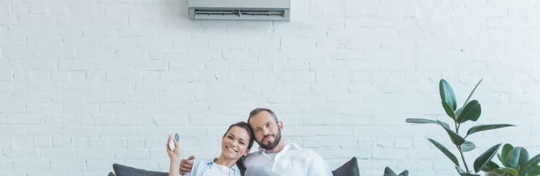 couple sitting on couch comfortable
