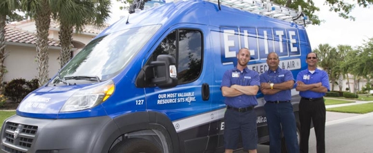 technicians next to company van