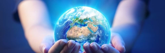 glowing globe held in hands