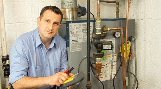 technician working on heater
