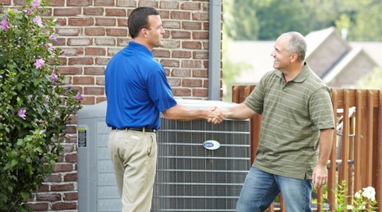 technician and customer shaking hands