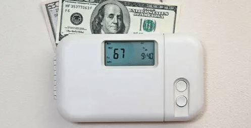 dollar bills on thermostat