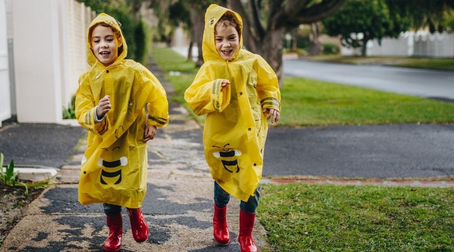kids walking in rain