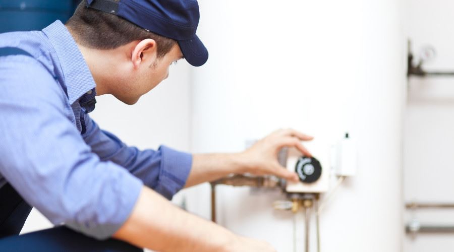 technician working on water heater