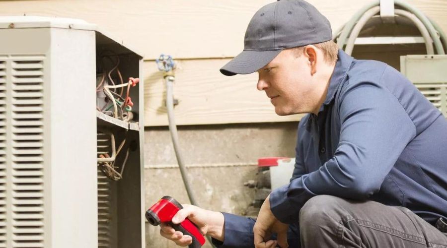 technician working on HVAC unit